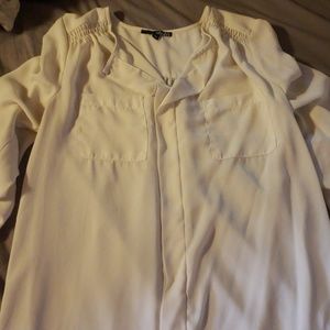 A flowy off white work type shirt